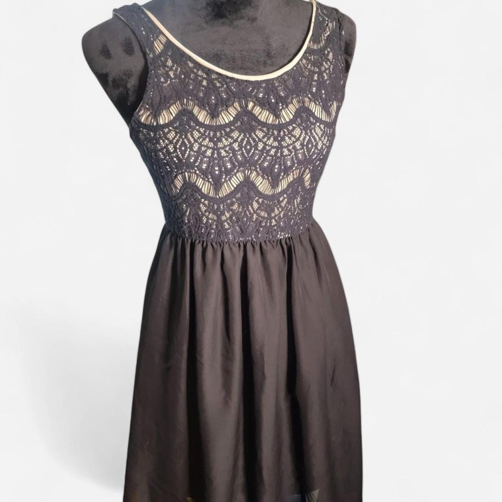 Adriene Adel black dress with nude undershirt and lace top